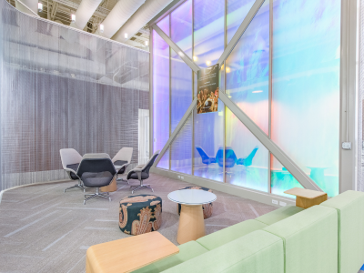 seating area at HP office in Austin, features a large window with a holographic style window film